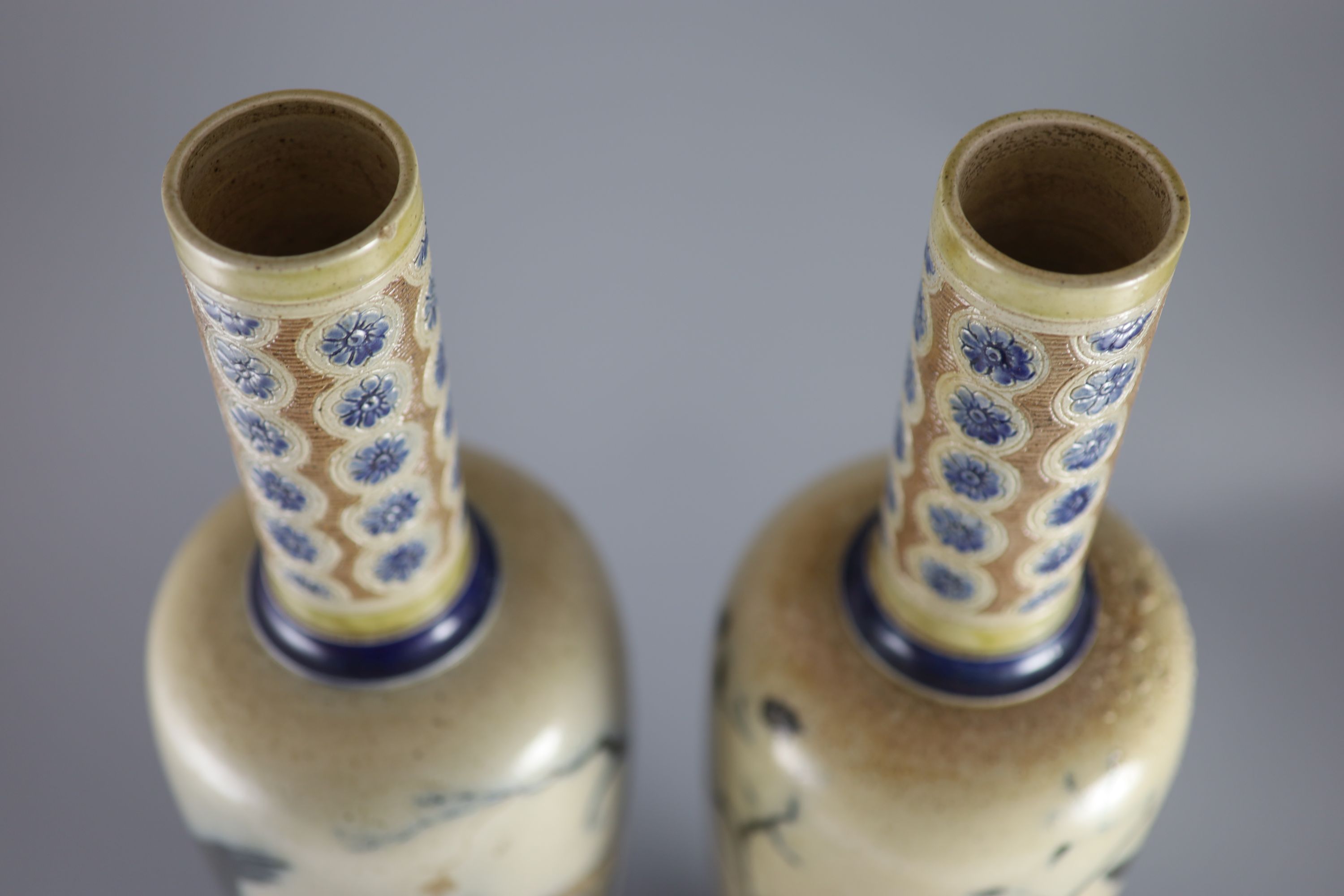 A pair of large Martin Brothers 'eagle and vulture' stoneware vases, dated 1878,